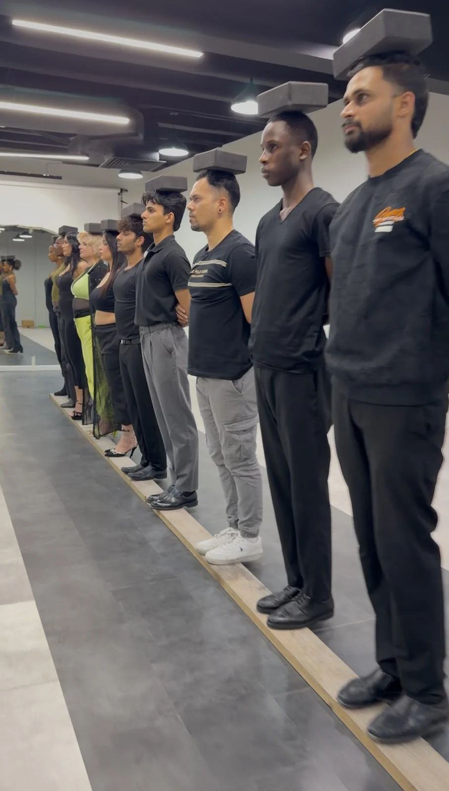Models practising balance and posture with blocks during a training exercise.