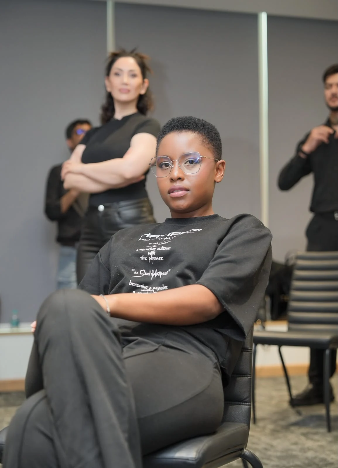 A participant practising a seated pose during a modeling session.